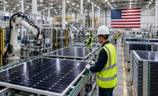 Modern American solar panel manufacturing facility with advanced production lines, solar modules, and clean energy technology in 2026.