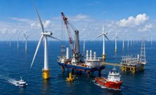 Large offshore wind farm in European waters generating renewable electricity with modern wind turbines and clean energy infrastructure.
