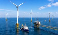Large offshore wind farm generating renewable electricity with modern wind turbines and clean energy infrastructure in 2026.