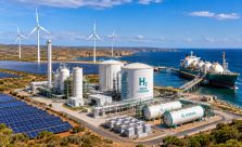 Large green hydrogen production facility in Western Australia featuring solar farms, hydrogen storage tanks, export infrastructure, and renewable energy systems.